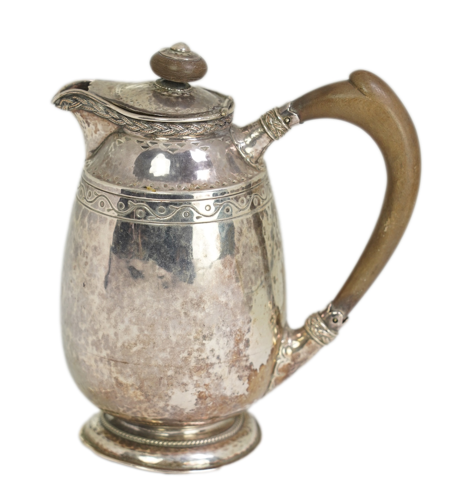 A George V Arts & Crafts silver hot water pot by Liberty & Co